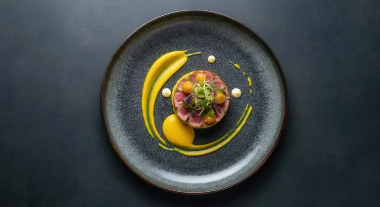 Elegant gourmet dish with artistic presentation on dark plate